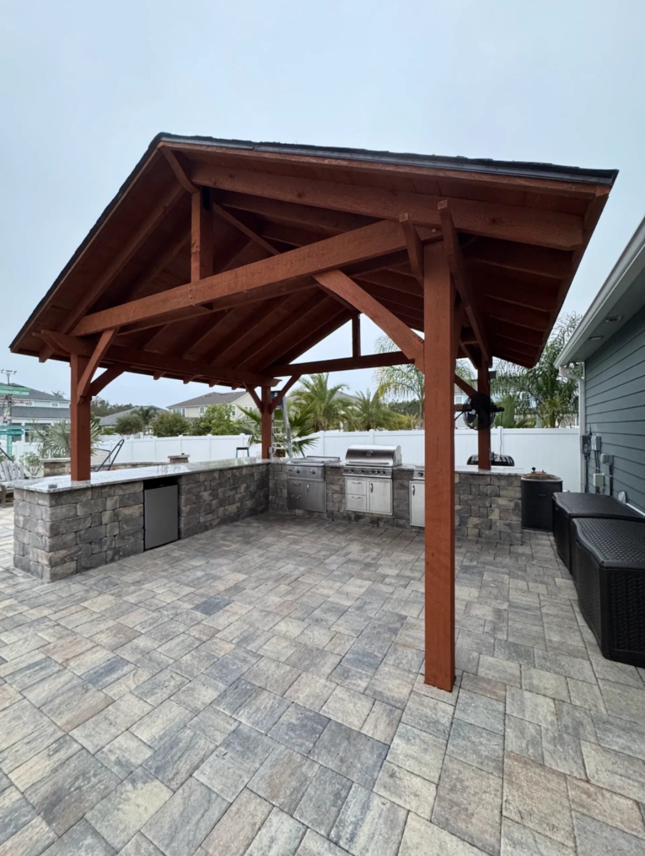 Outdoor kitchen and timber pavilion on pavers