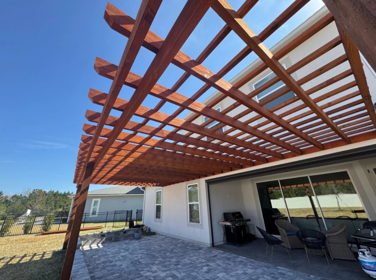 Large pergola over a paver patio